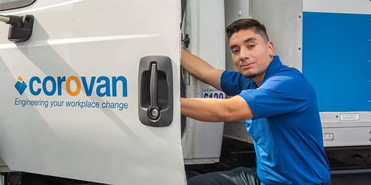 worker getting into a corovan truck
